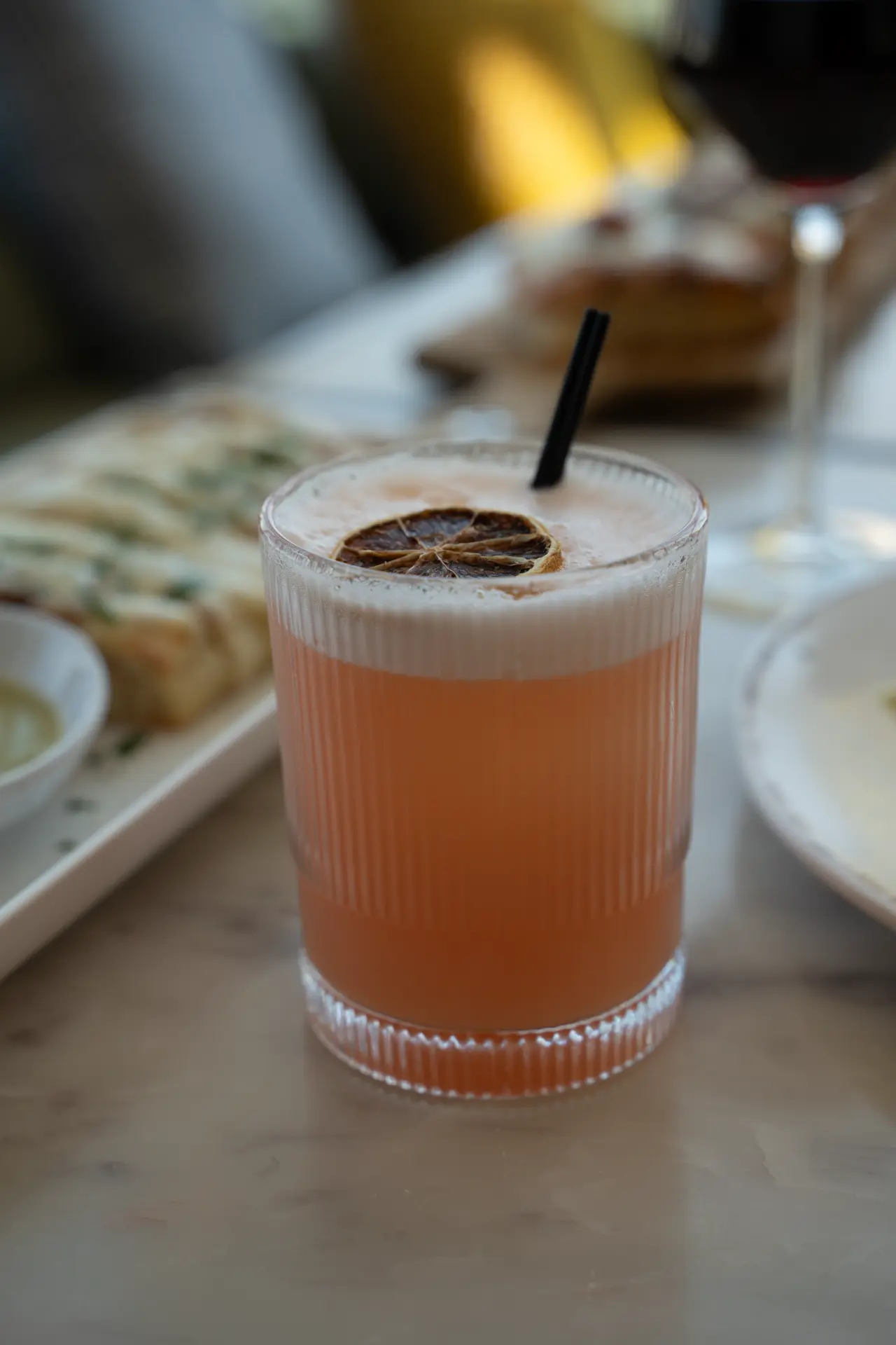 Fresh-pressed cocktail garnished with dried citrus