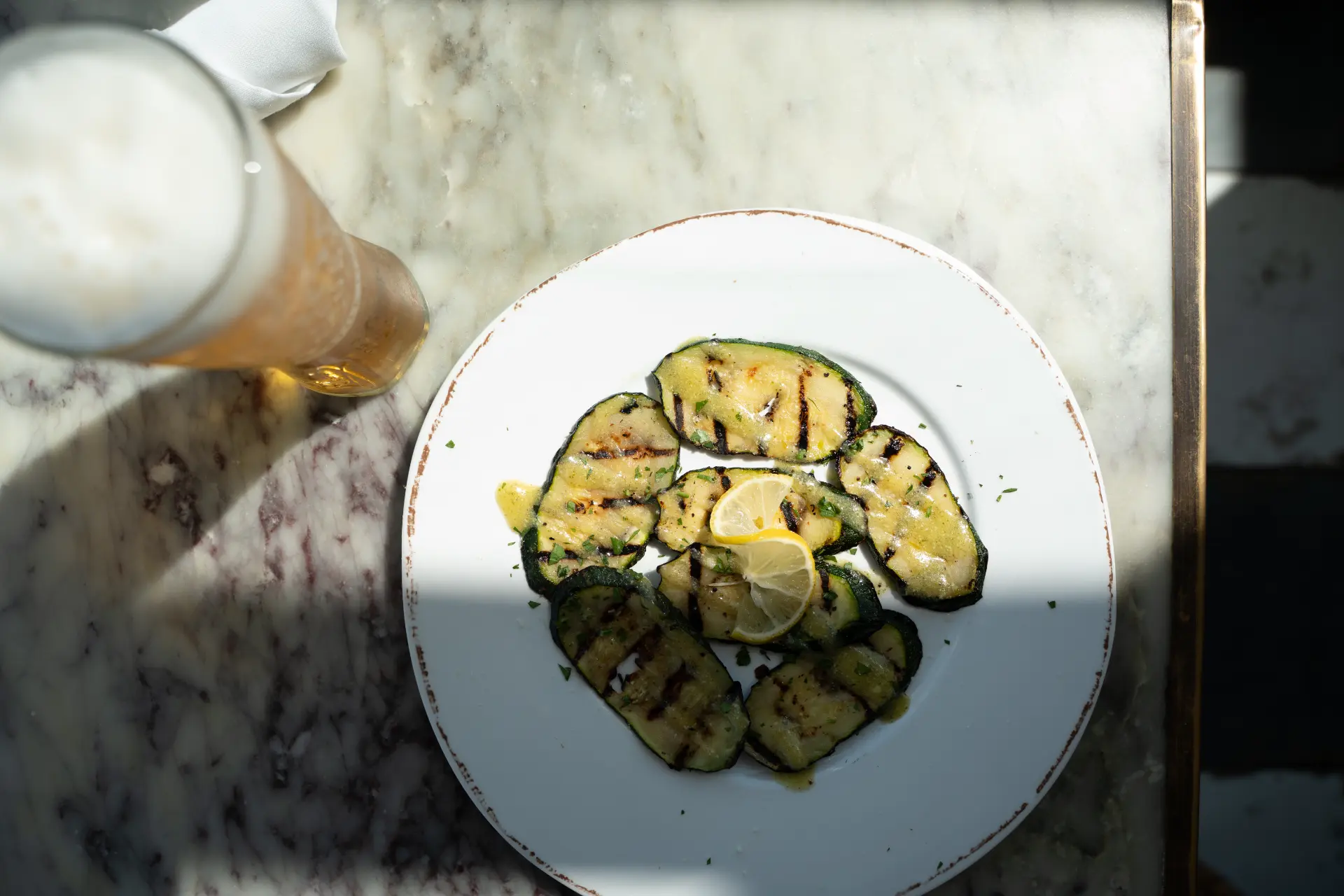 Grilled zucchini plate with a beer at Candle Bar